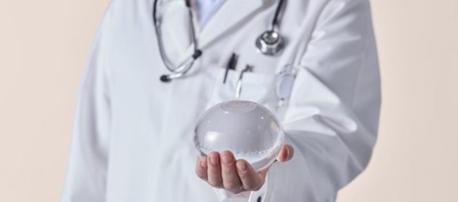 A Doctor holding the Allurion Gastric Balloon